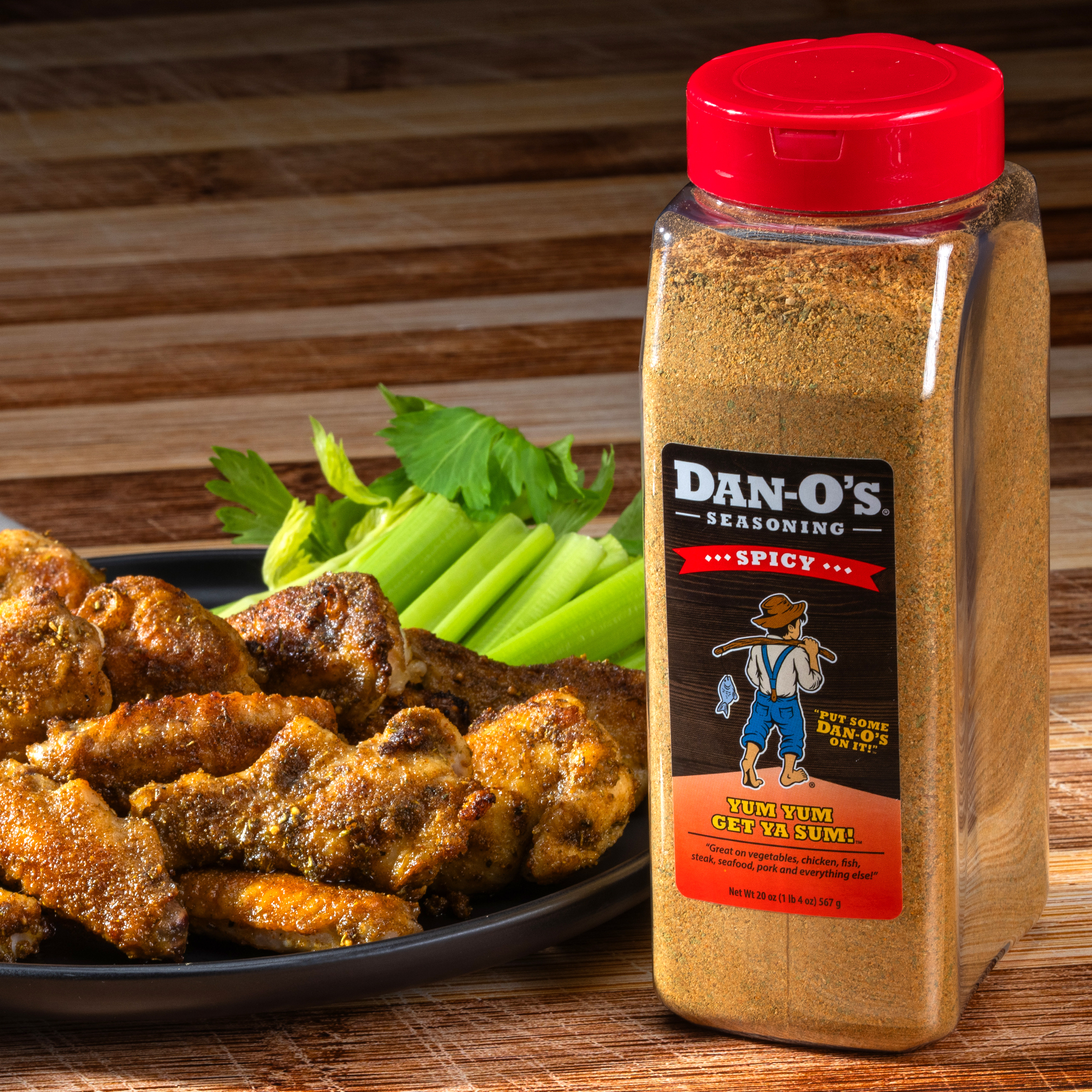 Delicious food featuring a generous sprinkle from a large bottle of Dan-O's Spicy Seasoning.