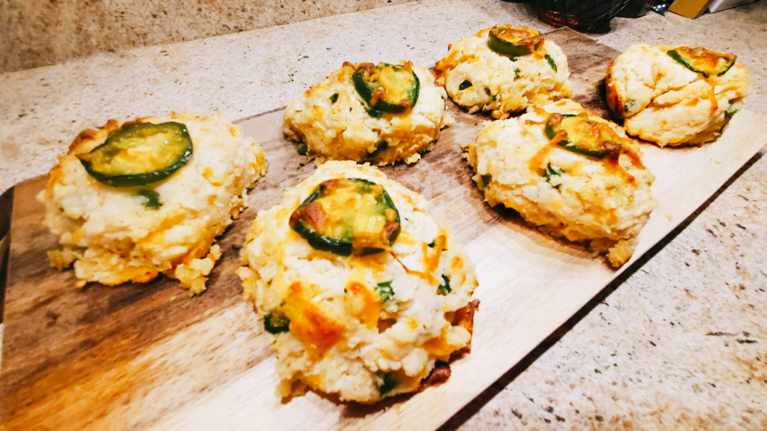 Image of jalapeno cheddar drop biscuits on a cutting board