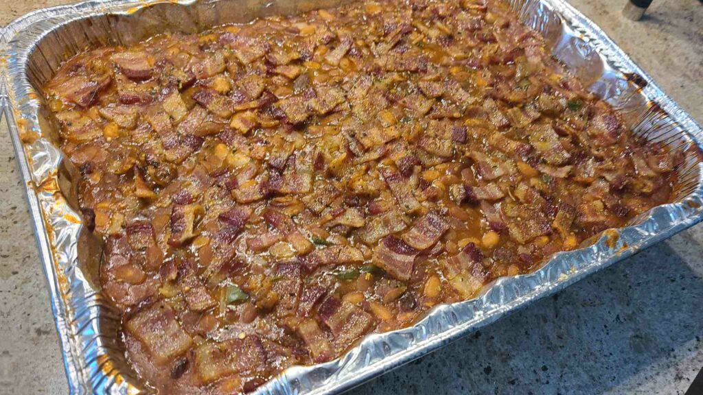 Cooked baked beans in aluminum pan