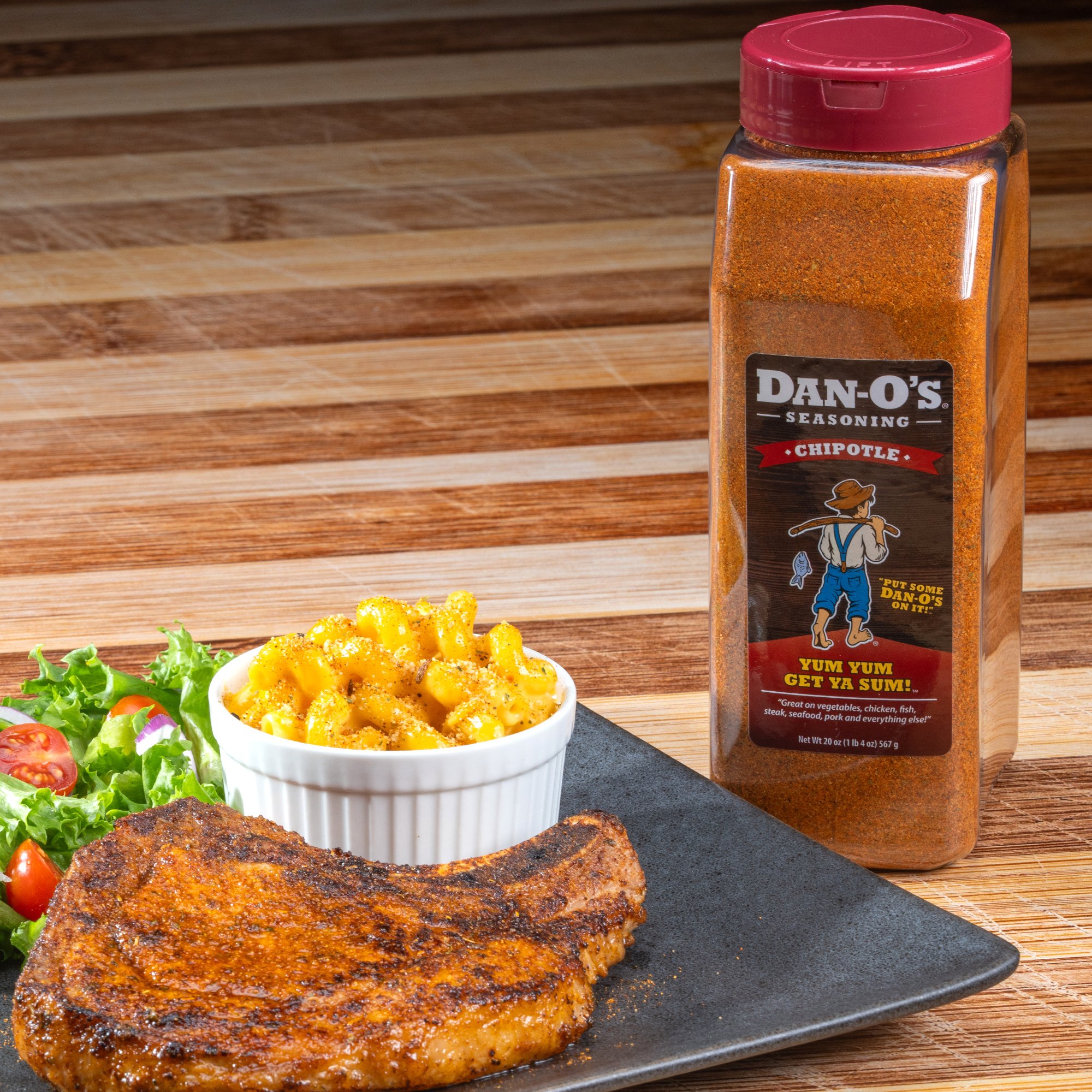 Delicious food featuring a generous sprinkle from a large bottle of Dan-O's Chipotle Seasoning.