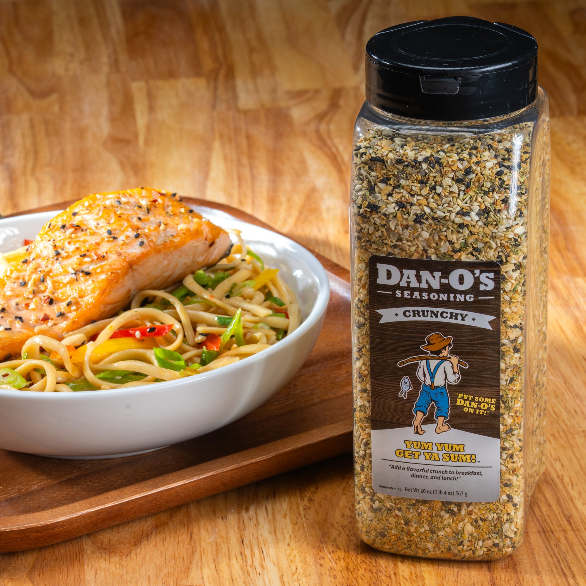 Delicious food featuring a generous sprinkle from a large bottle of Dan-O's Crunchy.